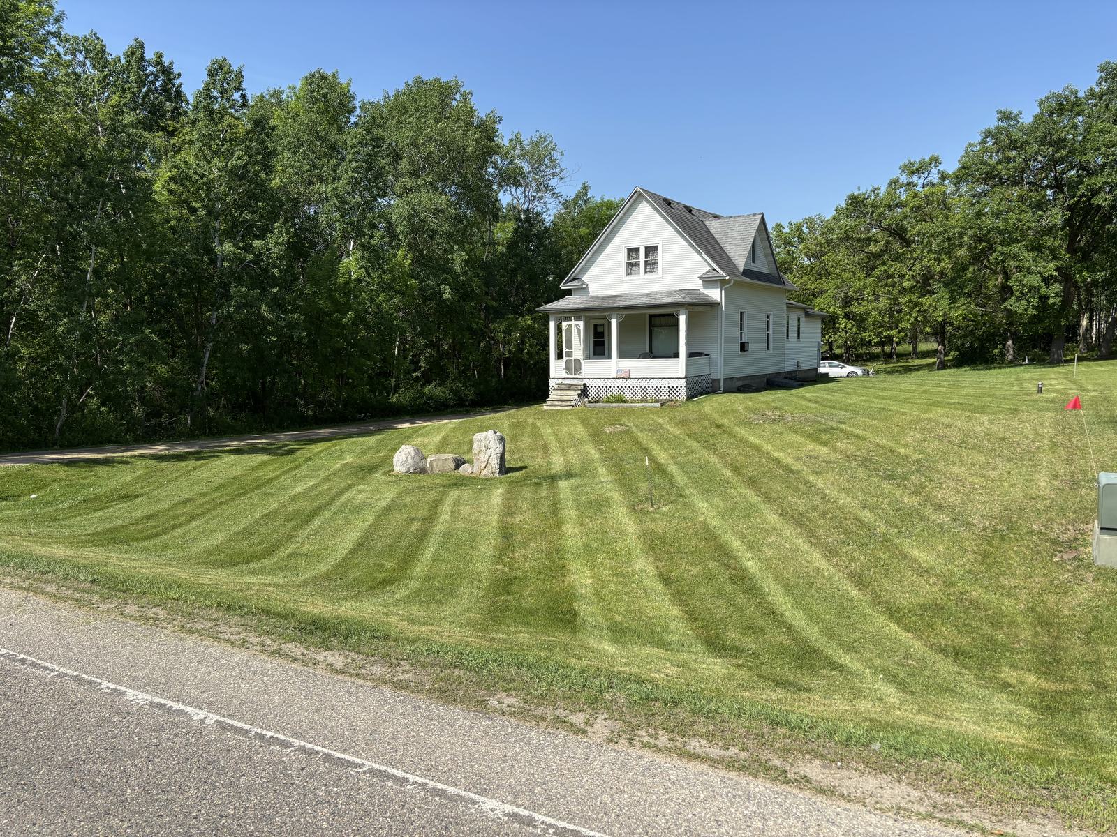 Striped lawn at a farmhouse property
